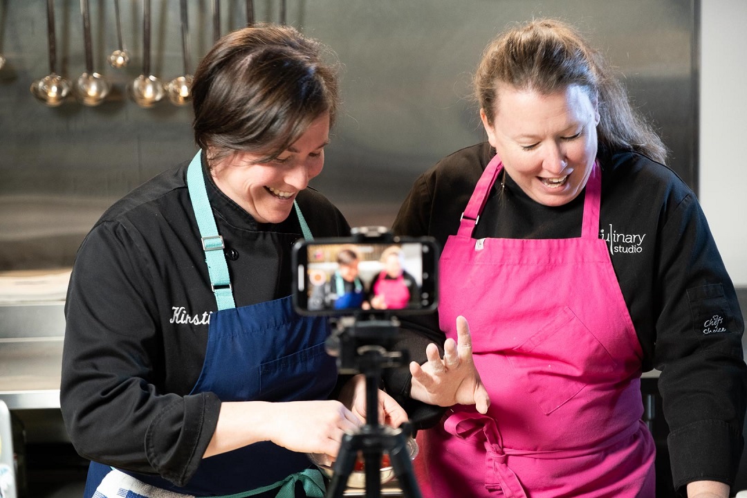 CAM49096 Two women chefs filming a demonstration