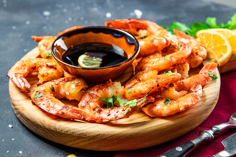 Shrimp on platter with sauce